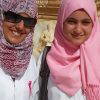 Two medical students are promoting breast cancer awareness by wearing pink ribbons and a pink hijab in Sabratha, Libya. Photo courtesy Wikimedia Commons.