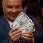 John King and his "fun money" at the Pink Diamond Dinner, a Maurer Foundation breast cancer prevention benefit
