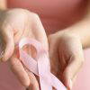 Hands holding breast cancer ribbon