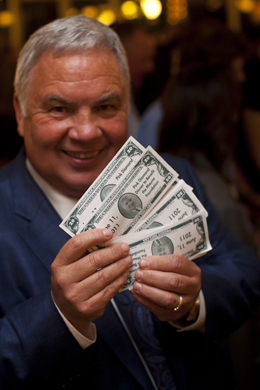 John King and his "fun money" at the Pink Diamond Dinner, a Maurer Foundation breast cancer prevention benefit