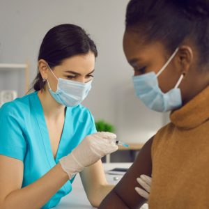 Woman Receiving a Vaccine